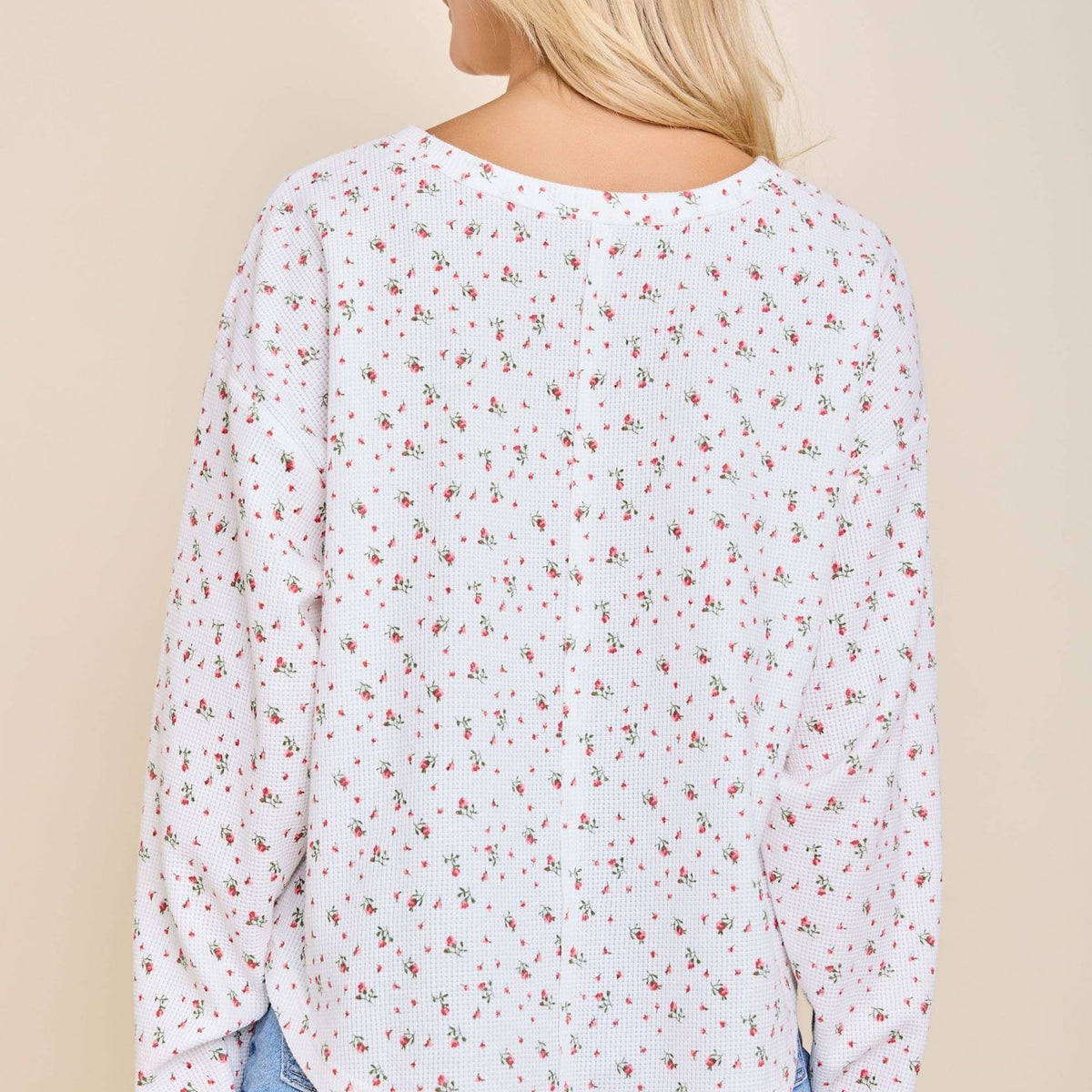 Back view of the white ditsy floral waffle knit henley top with an oversized fit