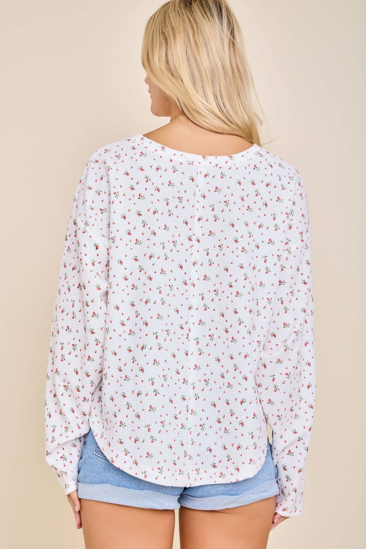 Back view of the white ditsy floral waffle knit henley top with an oversized fit