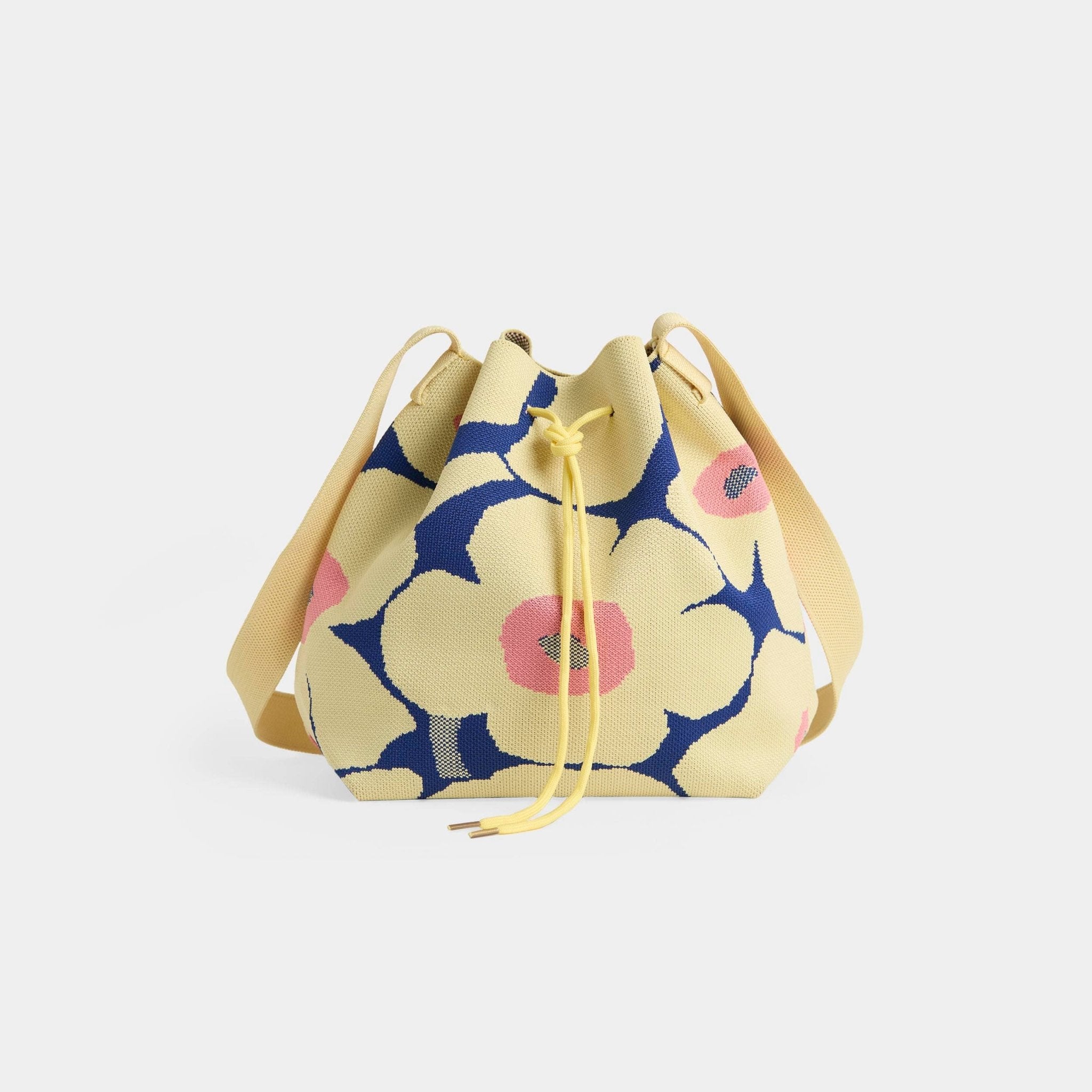 Floral patterned drawstring bag on a light gray background