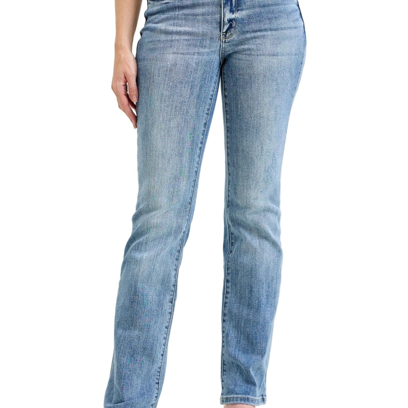 Person wearing light blue jeans on a plain background