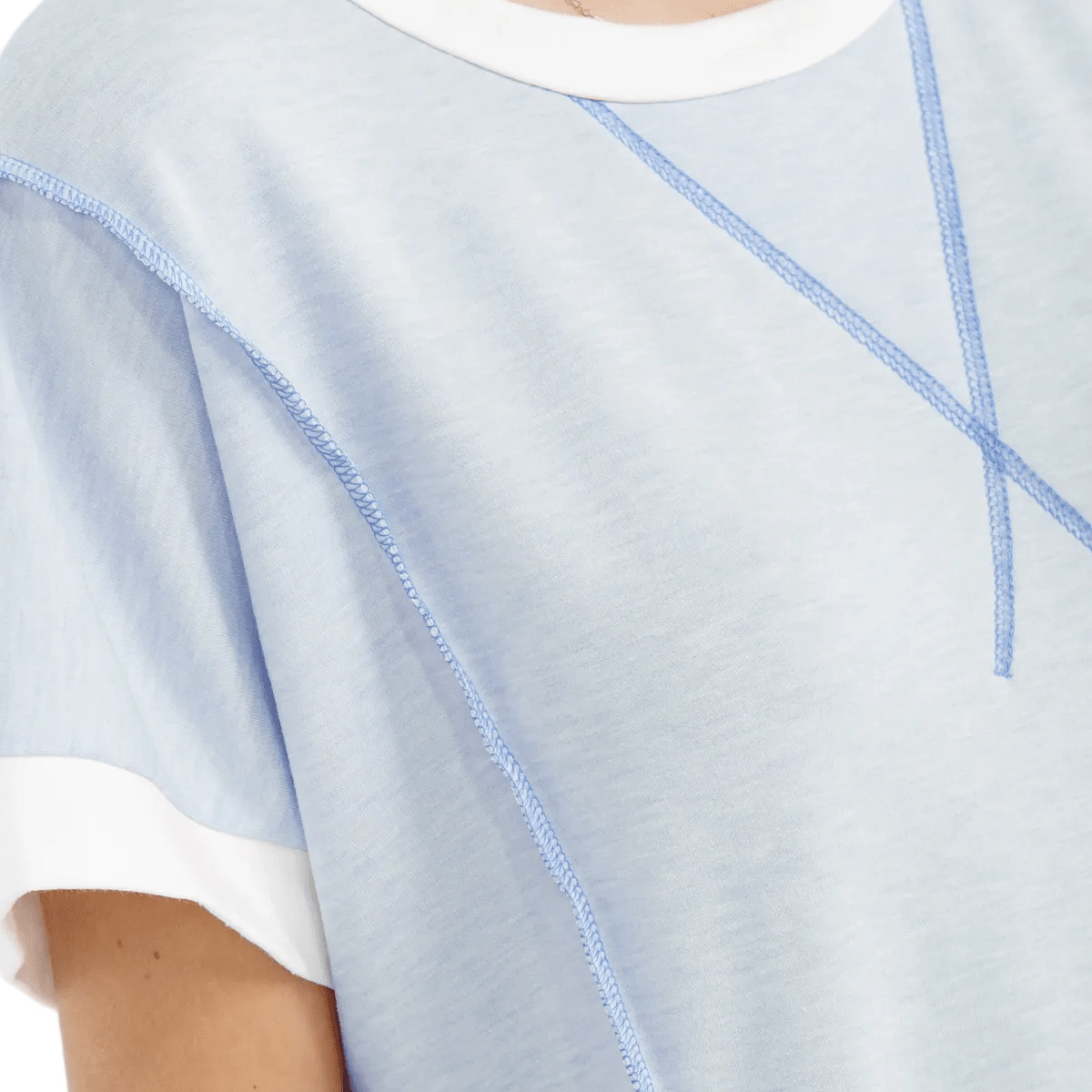 Light blue top with white trim worn by a person