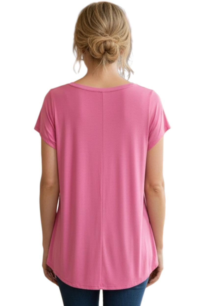 Pink t-shirt worn by a person on a white background