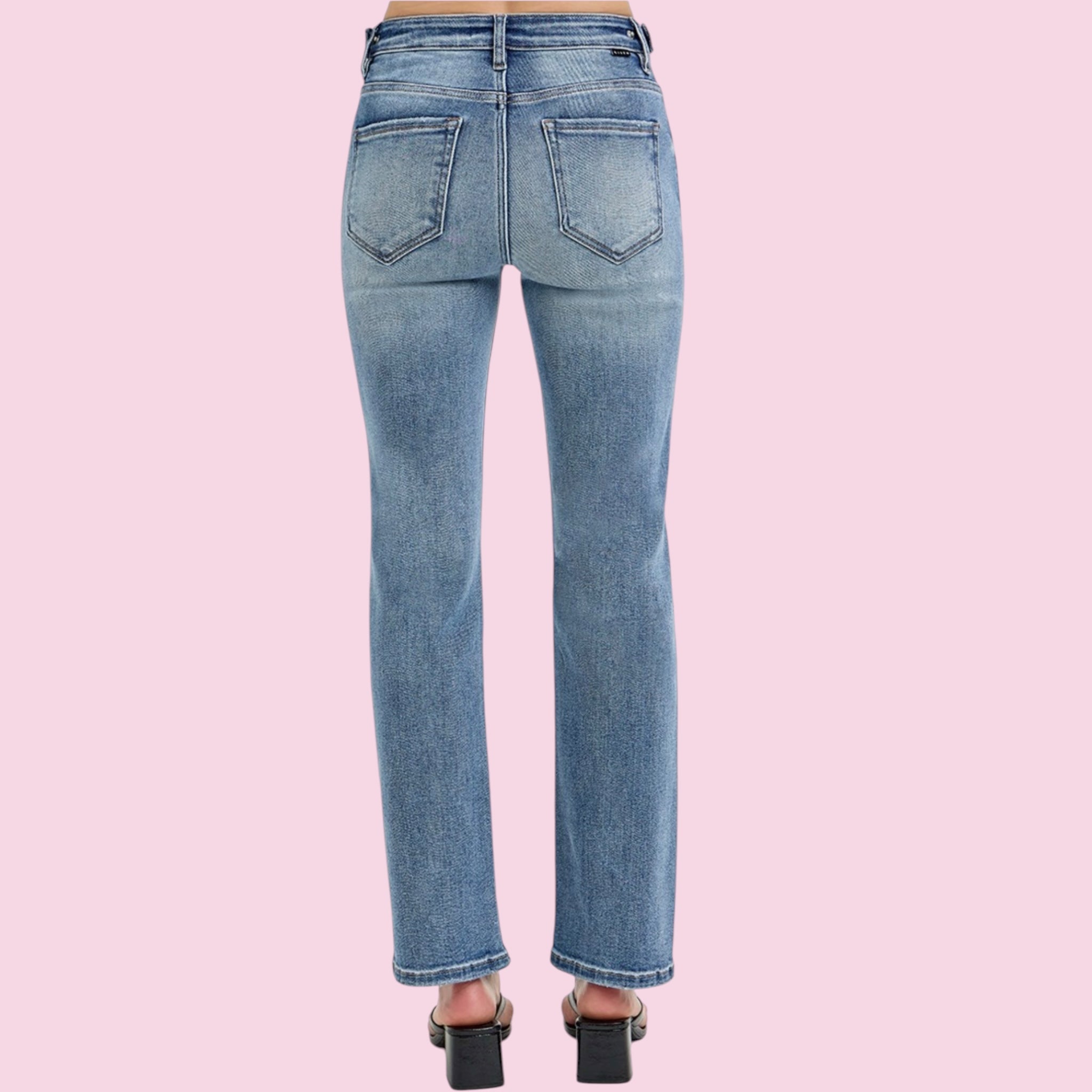 Blue jeans on a pink background