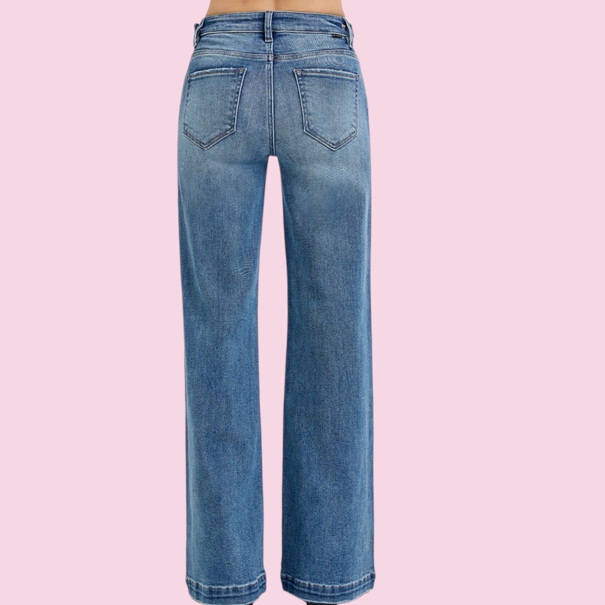 Blue jeans on a pink background