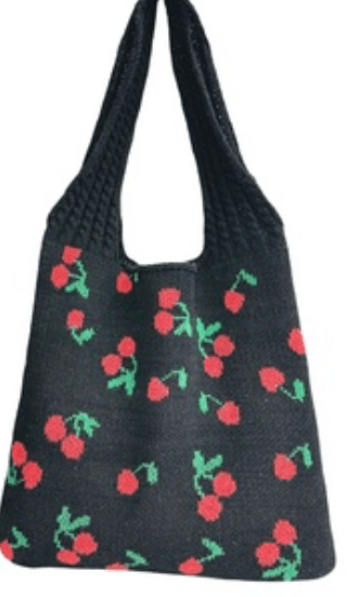 Black bag with red cherry pattern on a white background