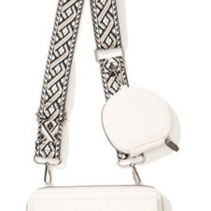 White vegan leather crossbody bag with patterned adjustable strap, side view