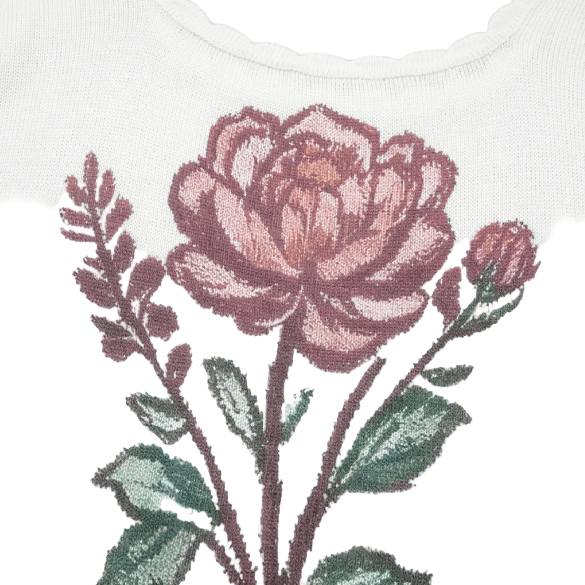 Embroidered flower design on a white fabric background