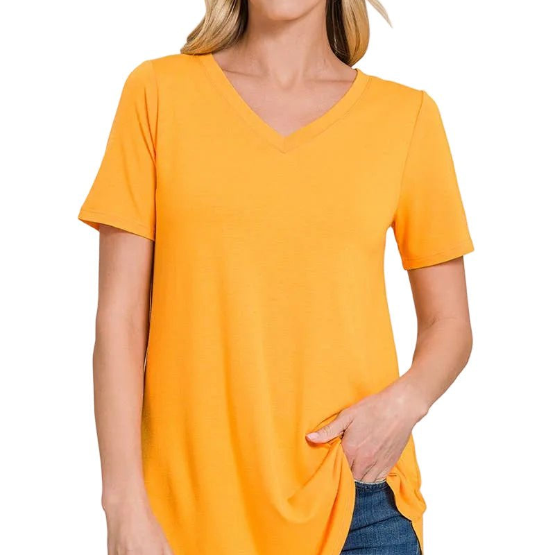 Woman wearing a yellow gold t-shirt on a white background