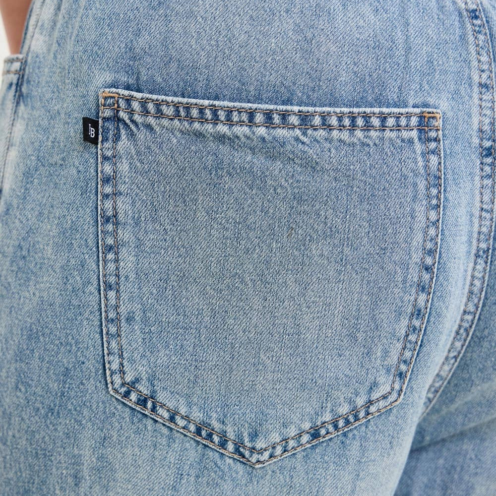 Close-up of back pocket detail on Judy Blue High Waist Palazzo Featherweight Drawcord Jeans, white background