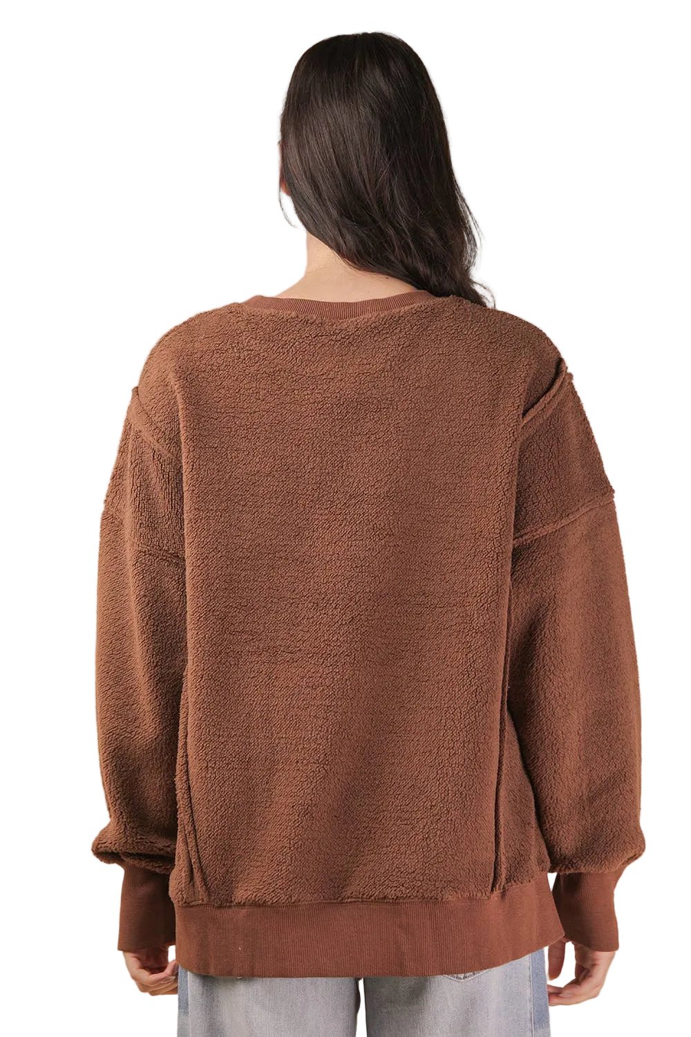 Back view of a women's chocolate brown oversized fleece top with drop shoulders and a longer back hem