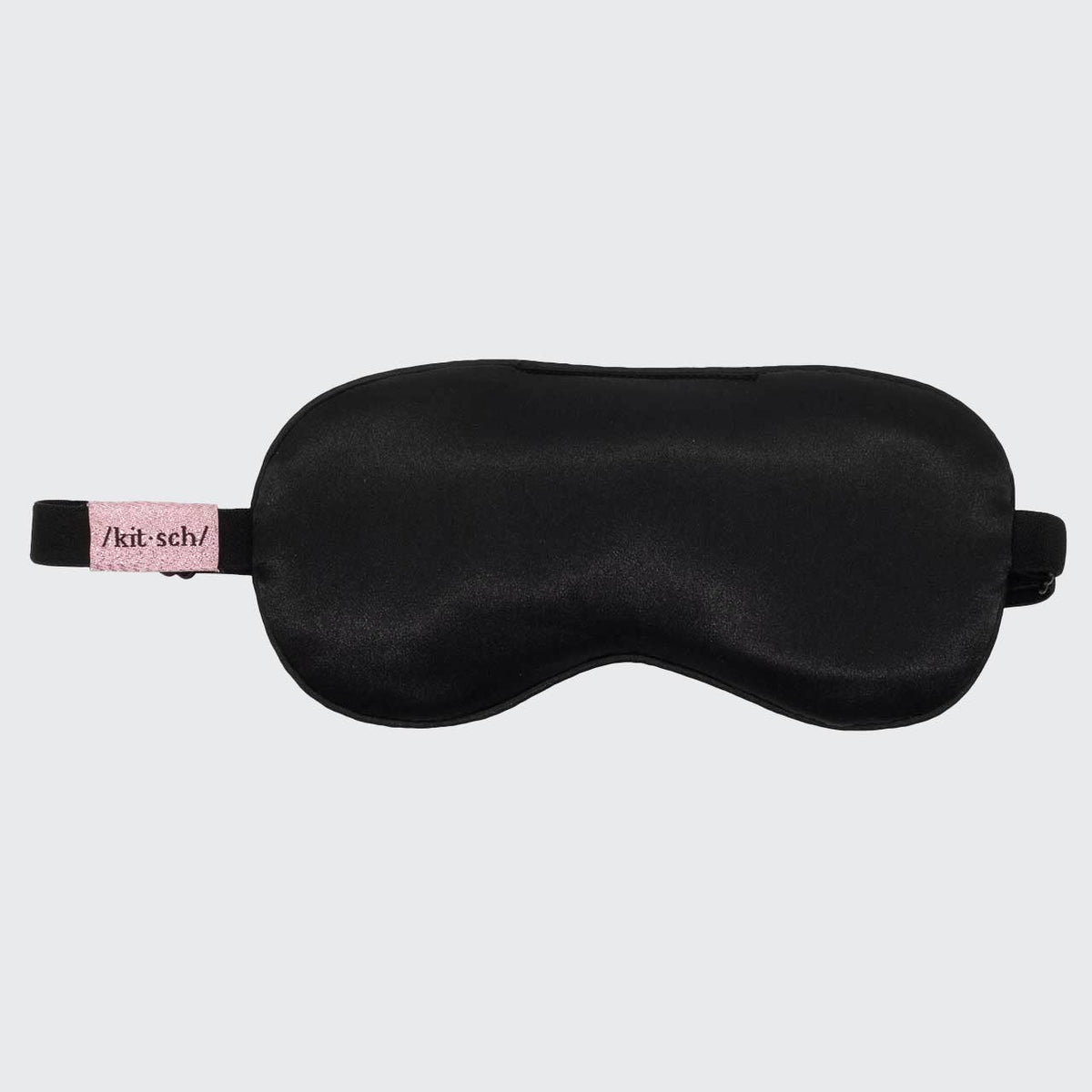 Black satin weighted sleep mask with adjustable strap and KITSCH tag