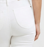 Close-up of a person wearing a white outfit with a blurred background