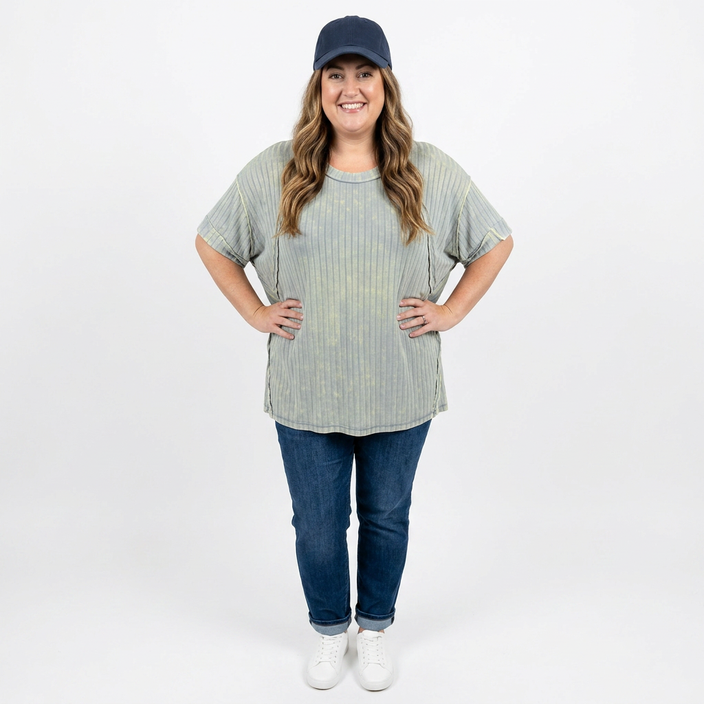 woman wearing baseball cap and ribbed long t-shirt with jeans