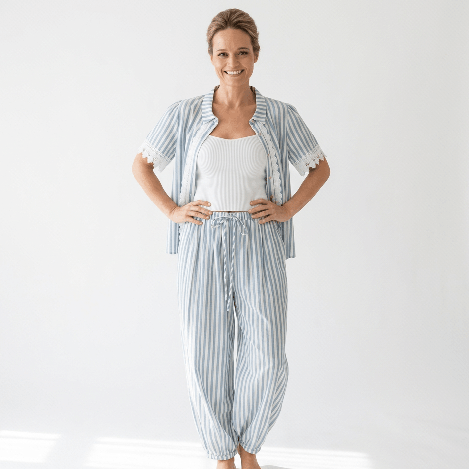 Woman wearing a striped outfit set on a white background