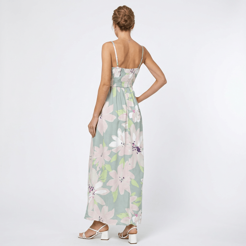 white background with woman showing the back of a floral dress