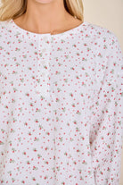 Close-up of the ditsy floral print and button-front placket on the waffle knit henley top