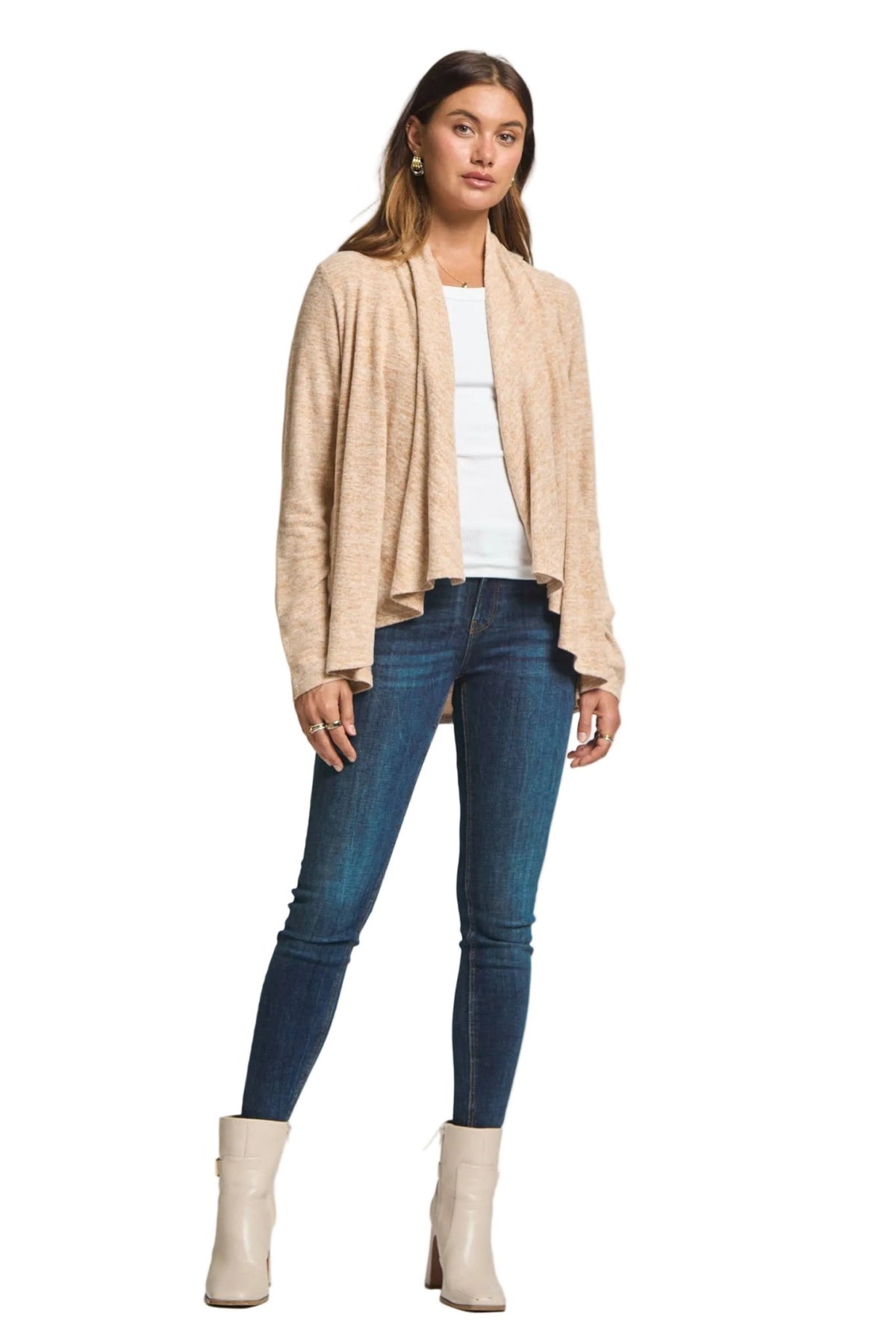 Front view of the multiwear cardigan worn open over a white top with jeans