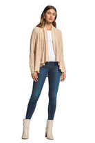 Front view of the multiwear cardigan worn open over a white top with jeans