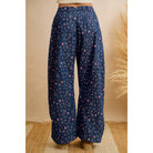 Back view of women's navy floral wide leg pants with a relaxed fit