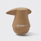 Close-up of the blonde KITSCH PONYFULL ponytail volumizer with its pick and gripping base