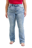 Person wearing light blue jeans and a red top on a plain background