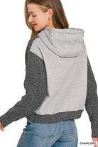 Back view of the charcoal knit hoodie sweater showing the heather gray cotton hood and back panel