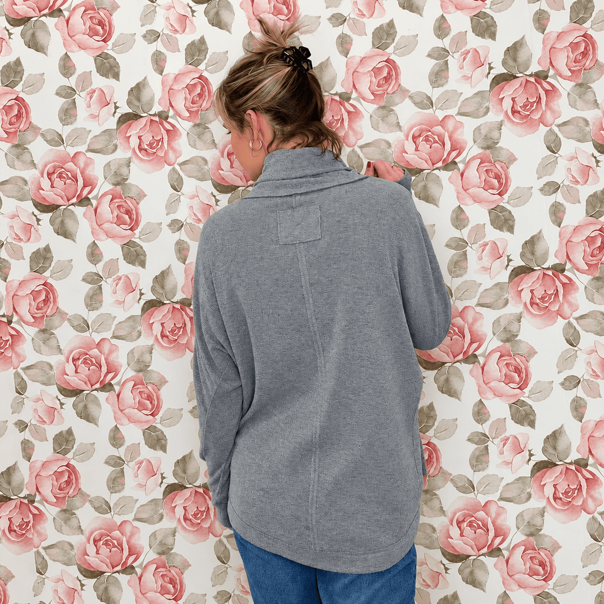 Back view of the heather gray mock neck tunic top showing the dolman sleeves, seam detailing and tunic length
