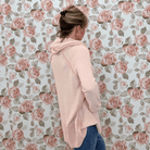 Back and side view of the smoke pink cowl neck top showing the relaxed tunic length and raglan sleeves
