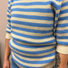 Close-up of a blue and white striped sweater