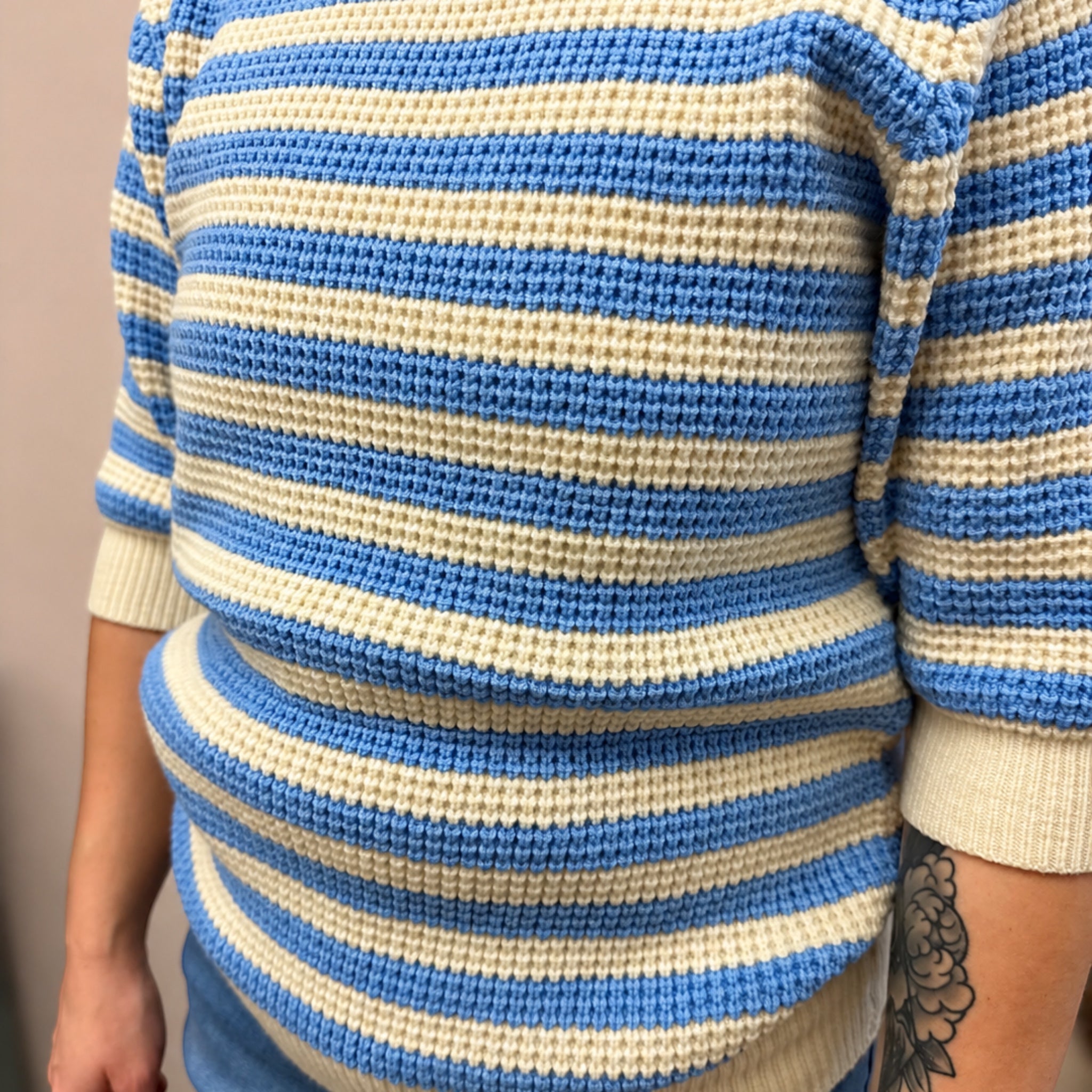 Close-up of a blue and white striped sweater