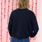 Back view of the navy Vintage Soul raw edge cardigan with a relaxed boxy fit