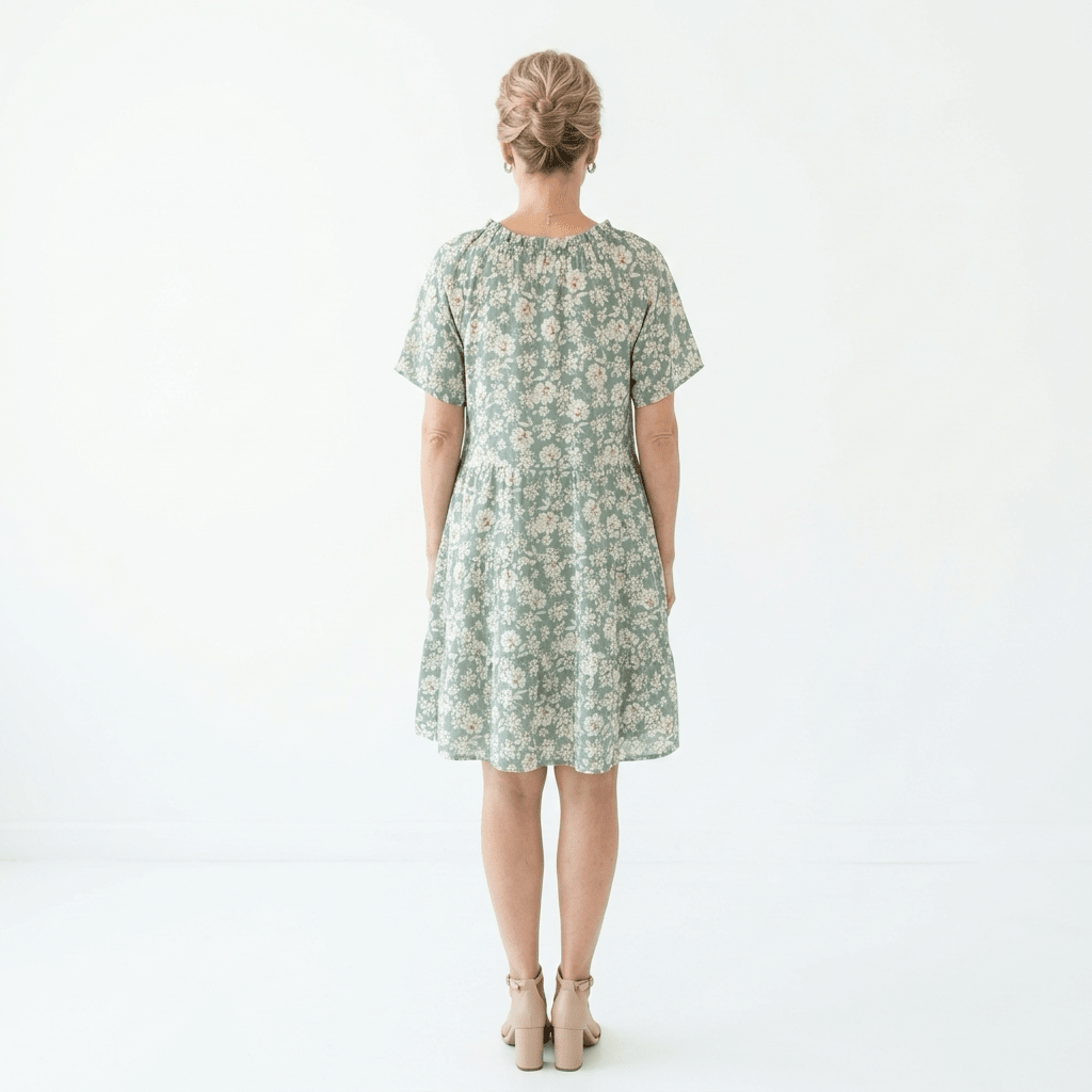 Woman wearing a floral dress on a white background