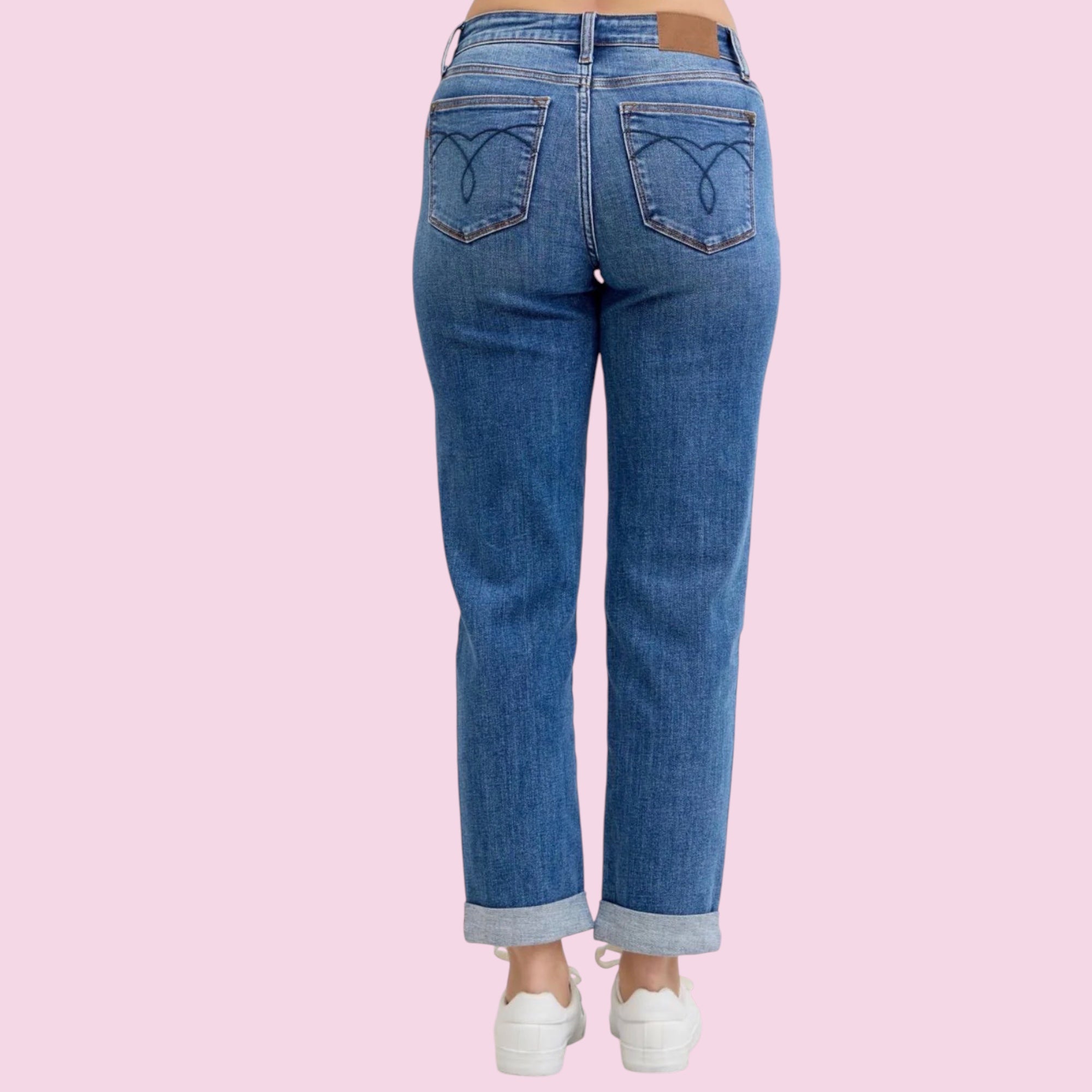 Blue jeans on a pink background