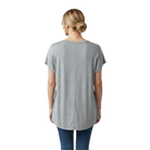 Person wearing a gray t-shirt and blue jeans on a white background