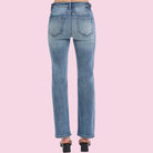 Blue jeans on a pink background