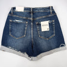Blue denim shorts with a visible brand label on a white background
