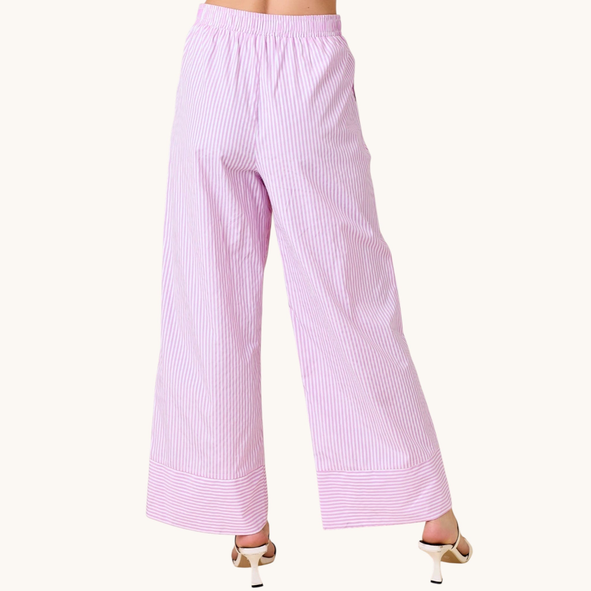 Pink striped pants on a white background