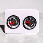 Pair of earrings with a heart design on a white card