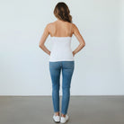 backside of white cami on gray background