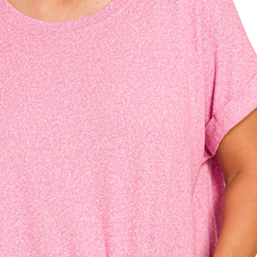 Close-up of a pink textured shirt worn by a person