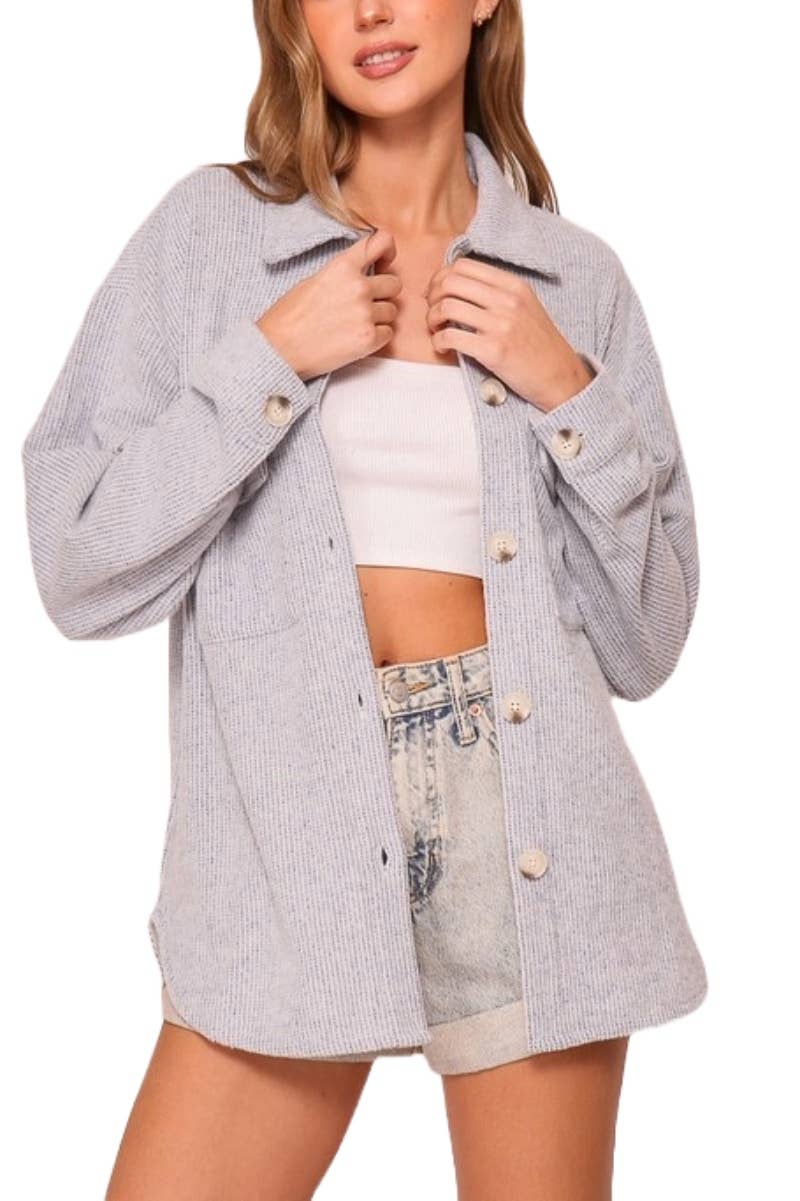Heather gray waffle knit button down shacket worn open with a white crop top and denim shorts, showing the relaxed fit
