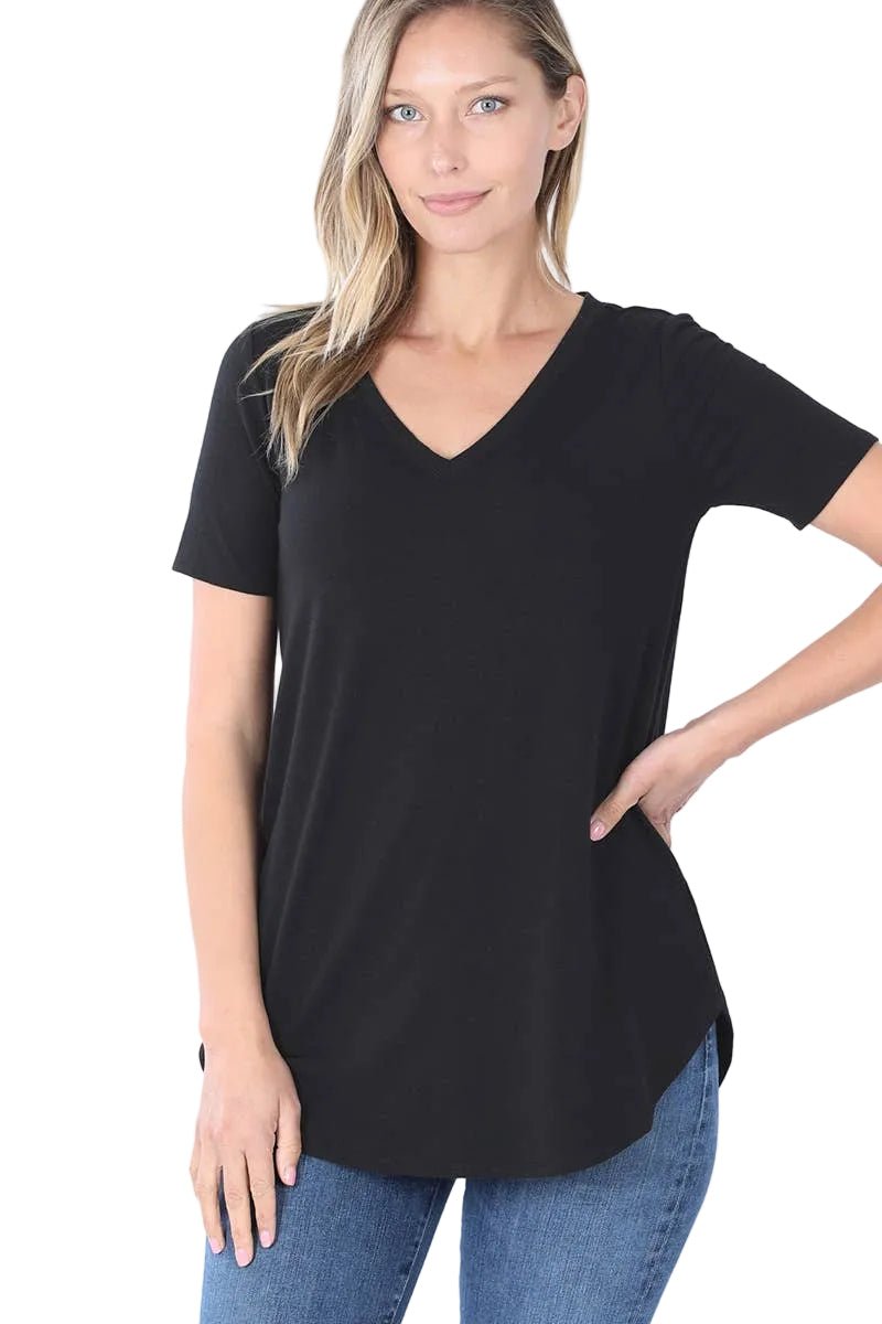Woman wearing a black t-shirt and blue jeans on a white background