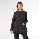 Front view of the midnight black brushed knit button back sweater