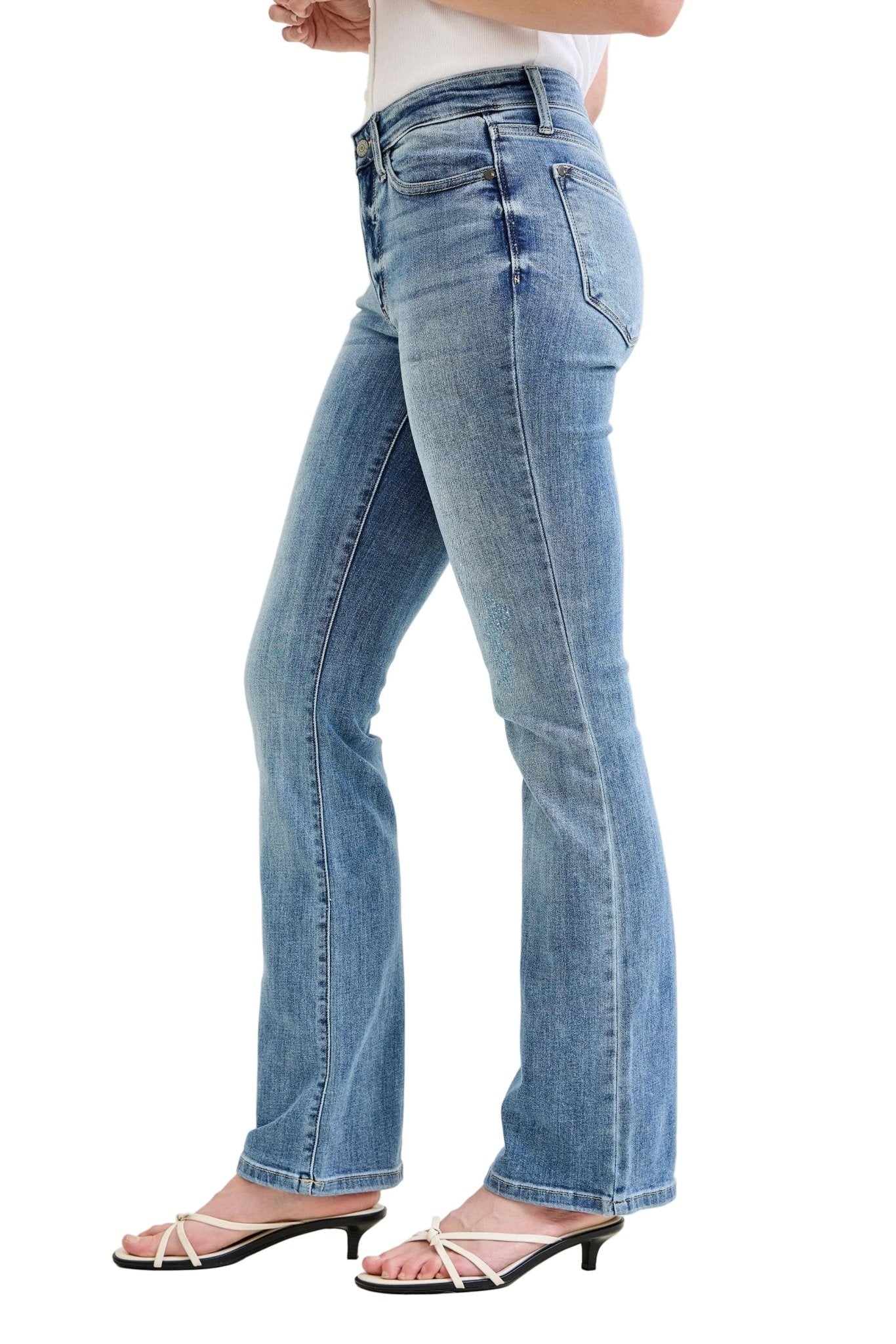 Light blue jeans worn by a person on a white background