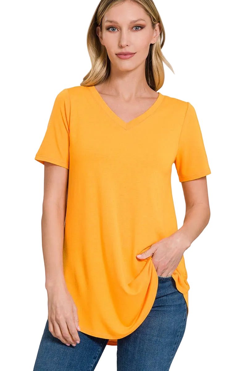Woman wearing a yellow gold t-shirt on a white background