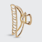 Side view of the gold open shape claw clip for thick hair